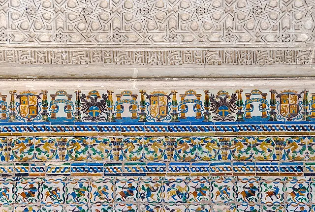 Azulejo frieze with coats of arms and eagles under arabesque stucco, at the Cenador de Carlos V
