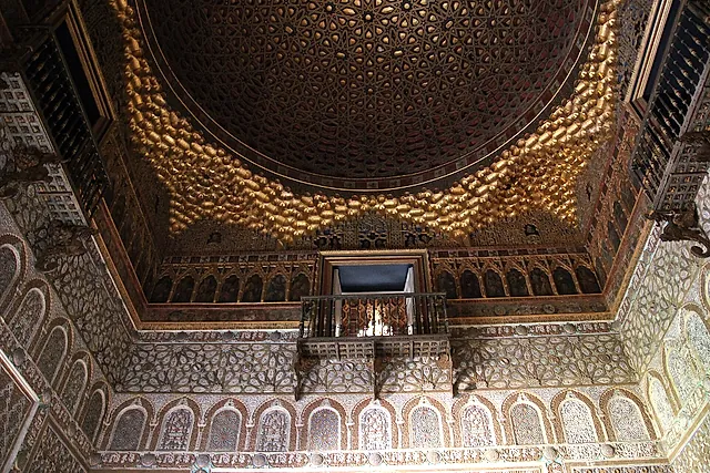 The gilded half-orange dome of the Salón de Embajadores, with its balconies