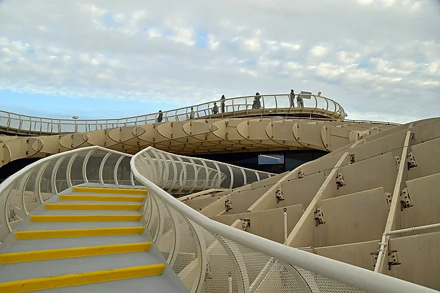The Metropol Parasol (Las Setas), with its walkway and yellow stairs under an overcast sky